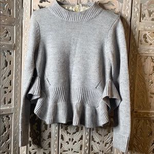 Soft knitted grey ruffle sweater